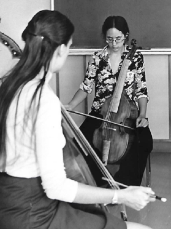 Meints teaching Mitzi Myerson, now a well known harpsichordist in Europe, how to draw a straight bow